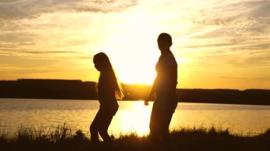 Party by the lake, the girls are dancing. teens girlfriends holiday disco. happy girls dancing on the beach. beautiful girls having fun listening to music. sisters are dancing.