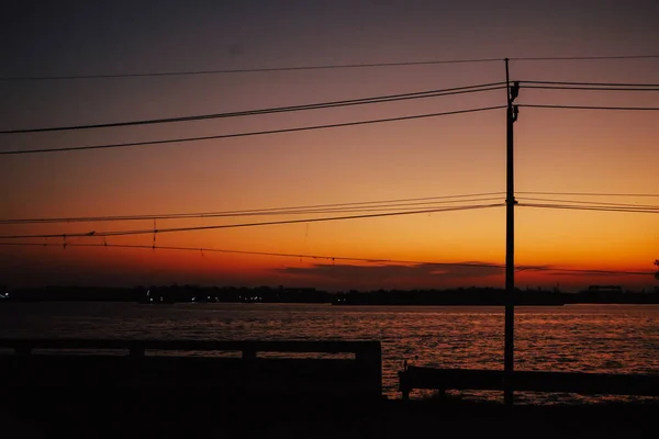 Electricity Pylons Wire Cable Street Lamp Post Sunset River Background — Stock Photo, Image