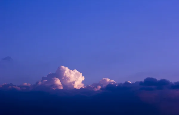 Big cloud on blue sky background