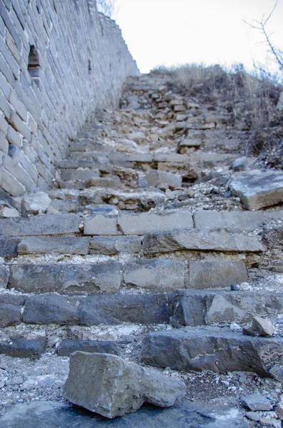 Ruined old stone staircase. The staircase of the Chinese great wall.