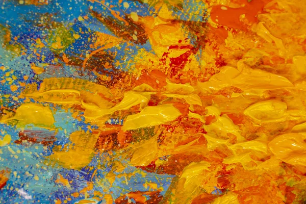 Abstract impressionism palette knife painting flame of fire, yellow orange bonfire on blue background - large fragment of oil painting