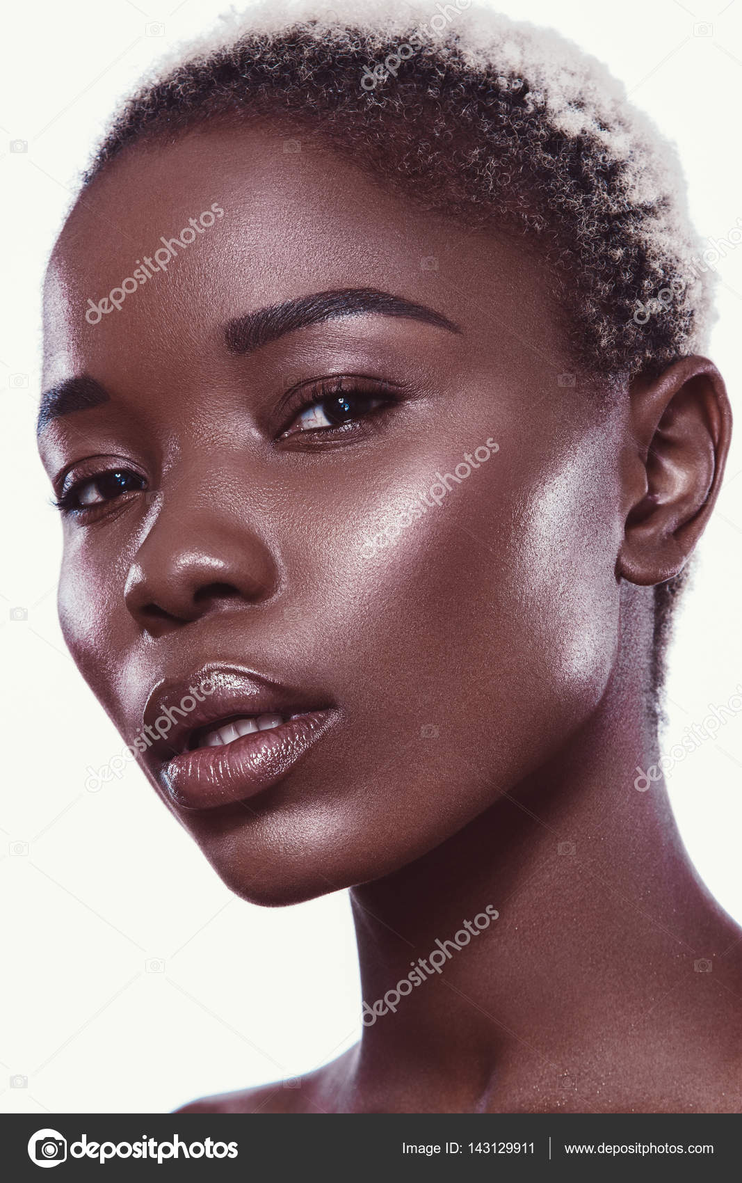 Fashion Woman With A Short Haircut And Black Skin Posing In