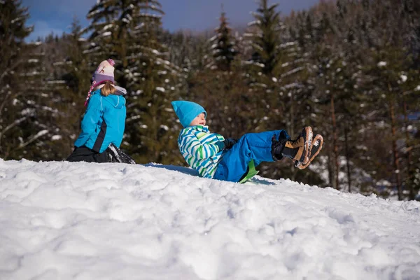 Little Boy Sliding Snow His Winter Holiday — kuvapankkivalokuva