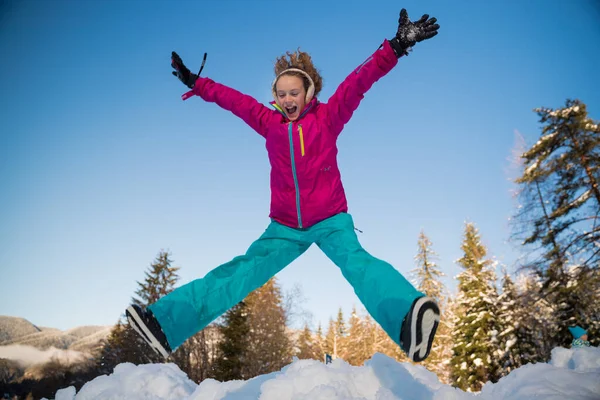 School Girl Jumping Air Snow – stockfoto