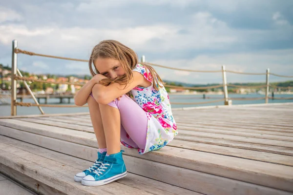 Upset School Girl Sitting Pier Cloudy Day – stockfoto