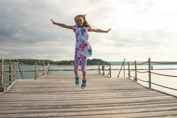 Girl Jumping High Air Seaside – stockfoto
