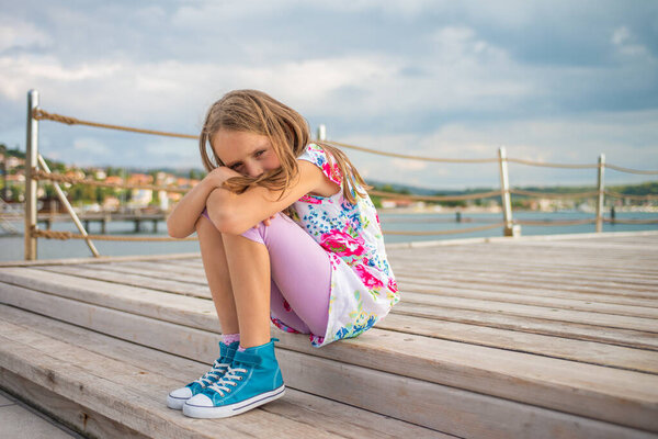 Upset School Girl Sitting Pier Cloudy Day Royalty Free Stock Photos