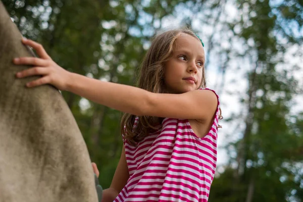 Active Little Girl Climbing Tree Forest – stockfoto