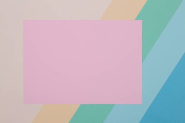 Mavi, yeşil, sarı ve pembe arkaplan, renkli kağıt geometrik olarak bölgelere bölünür, çerçeve, boşluk kopyala.