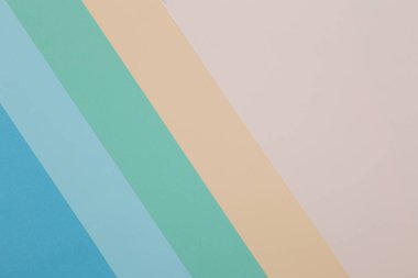 Mavi, yeşil, sarı arkaplan, renkli kağıt geometrik olarak bölgelere bölünür, çerçeve, boşluk kopyala.