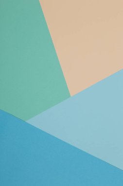 Mavi, yeşil, sarı arkaplan, renkli kağıt geometrik olarak bölgelere bölünür, çerçeve, boşluk kopyala.