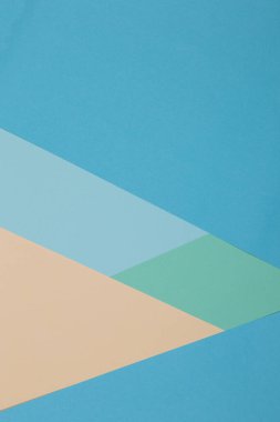 Mavi, yeşil, sarı arkaplan, renkli kağıt geometrik olarak bölgelere bölünür, çerçeve, boşluk kopyala.
