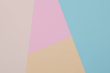 Mavi, sarı ve pembe arkaplan, renkli kağıt geometrik olarak bölgelere bölünür, çerçeve, boşluk kopyala.