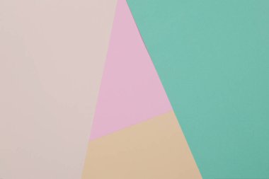 Yeşil, sarı ve pembe arkaplan, renkli kağıt geometrik olarak bölgelere bölünür, çerçeve, boşluk kopyala.