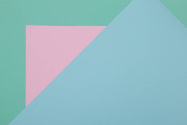 Mavi, yeşil ve pembe arkaplan, renkli kağıt geometrik olarak bölgelere bölünür, çerçeve, boşluk kopyala.