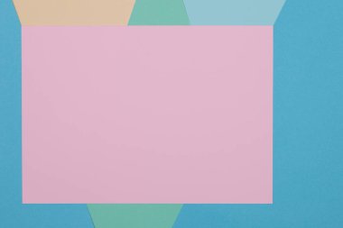 Mavi, yeşil, sarı ve pembe arkaplan, renkli kağıt geometrik olarak bölgelere bölünür, çerçeve, boşluk kopyala.