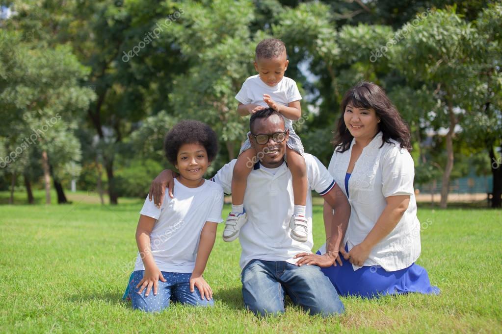 Happy diverse and mixed race family group photo in the