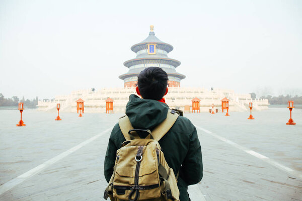 Young traveler walking towards temple of heaven - in Beijing, China. Asia Travel