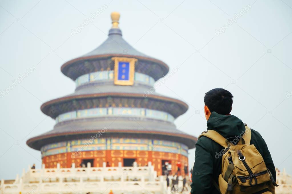 Young traveler standing in front of temple of heaven - in Beijing, China. Asia Travel