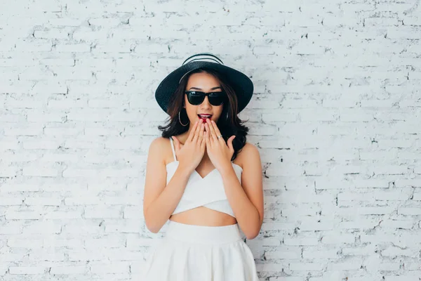 Young Woman Giving Surprise Look Fashionable Sunglasses Summer Hat White — Stock Photo, Image