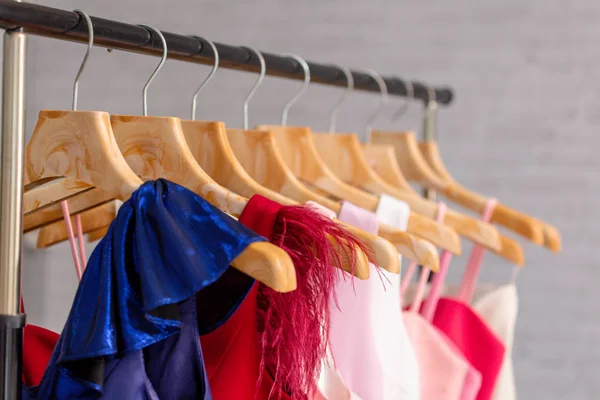 Colorful dress collection on hangers in boutique — Stock Photo, Image