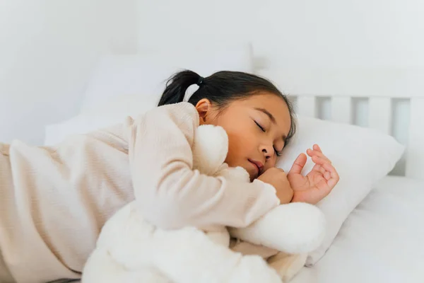 Asian preschooler sleeping on bed at home — Stock Photo, Image