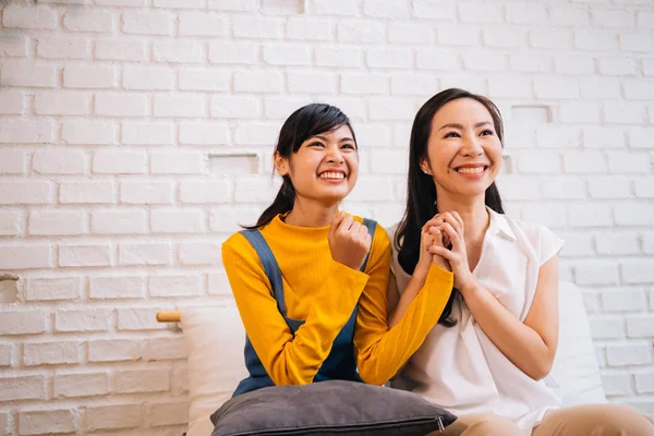 Excited Asian females watching TV — Stock Photo, Image