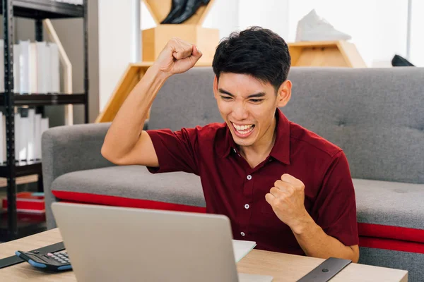 Successful remote worker enjoying victory watching laptop at home — 스톡 사진