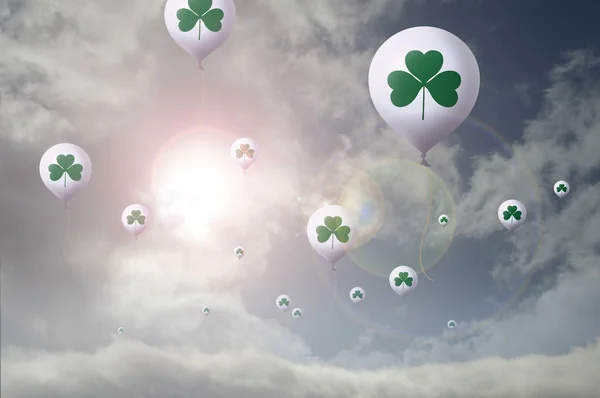 balloons with shamrock symbol floating in air