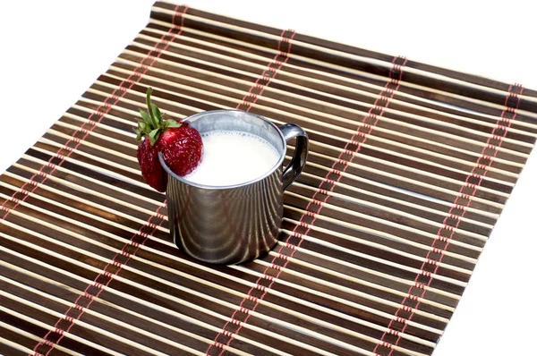 Steel mug with milk drink on a rug, isolate — Stock Photo, Image