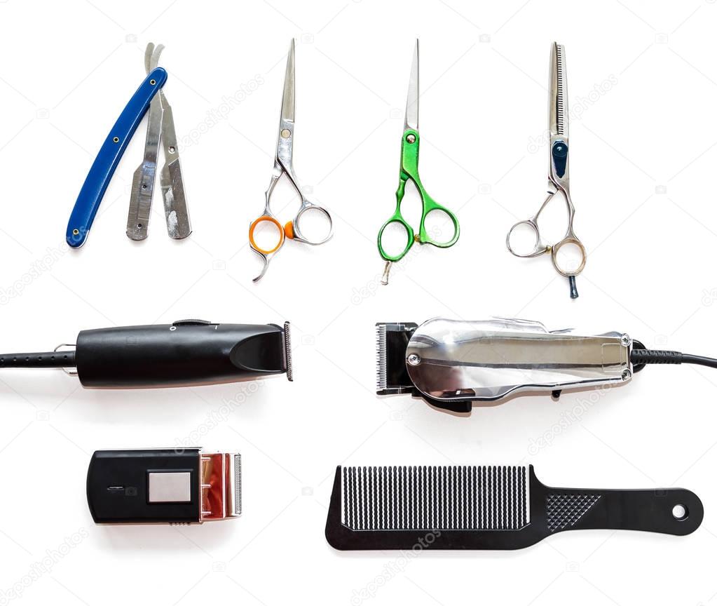 Barber shop equipment tools on white background. Professional hairdressing tools. Comb, scissor, clippers and hair trimmer isolated. 