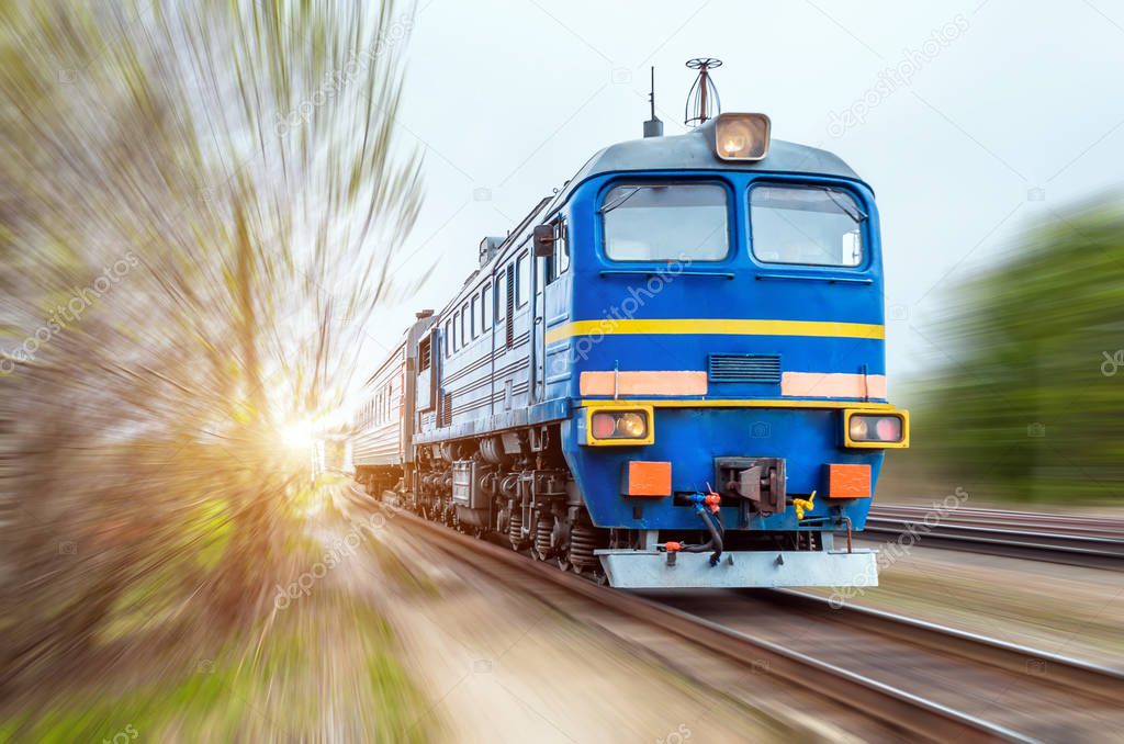 Locomotive in the composition of a passenger train in motion at speed.