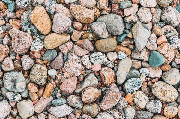 Textura de fondo de piedras redondas de granito playa . — Foto de Stock