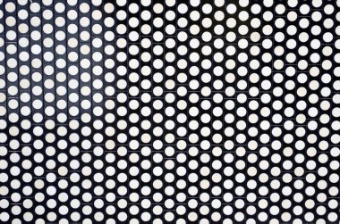 Bir taşı şeklinde siyah metalik arka plan üzerinde beyaz daireler