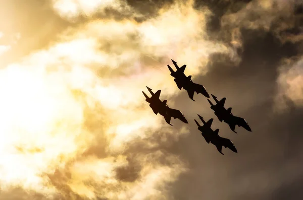 Group of fighter jet airplane sun glow blue sky — Stock Photo, Image