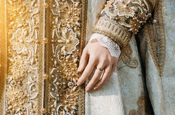 Clothes of a historical imperial woman with pastel tones, a hand with a ring with a precious stone — Stock Photo, Image