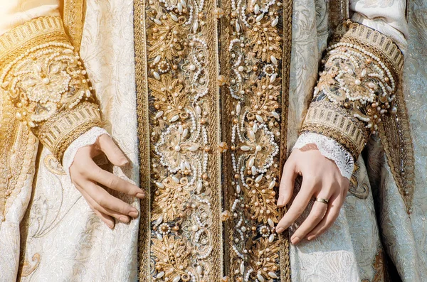 Clothes of a historical imperial woman with pastel tones, hands with a ring with a precious stone — Stock Photo, Image