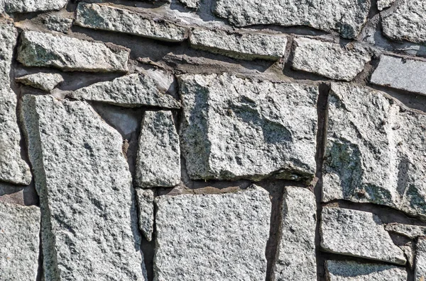 Stein Textur. abstrakter Hintergrund des alten Kopfsteinpflasters in Nahaufnahme — Stockfoto