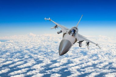 Military fighter jet above the clouds. clipart
