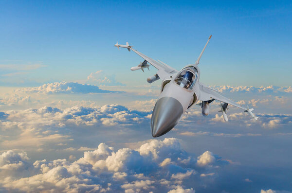 Military fighter jet against a blue sky with a backlight from below.