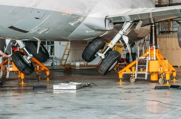 Gear up gear down chassis in the hangar after aircraft repair. — Stock Photo, Image