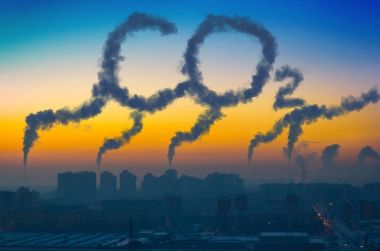 Evening view of the industrial landscape of the city with smoke emissions from chimneys at sunset CO2. clipart