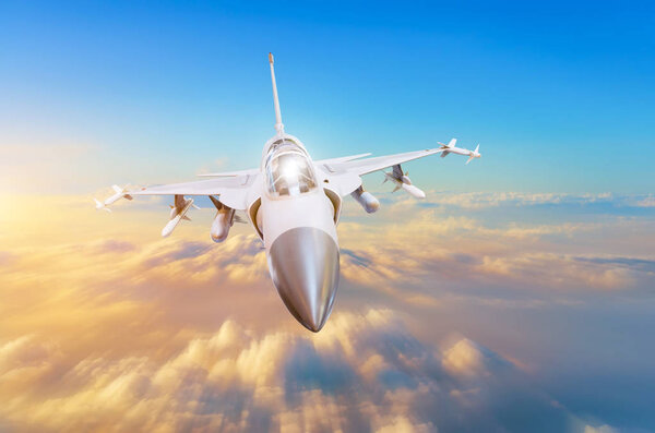 Military fighter aircraft at high speed, flying high in the sky sunset.