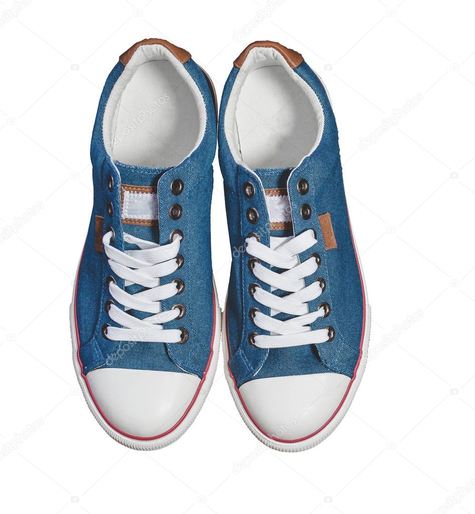Pair of new blue sneakers isolated - view from above on white background.
