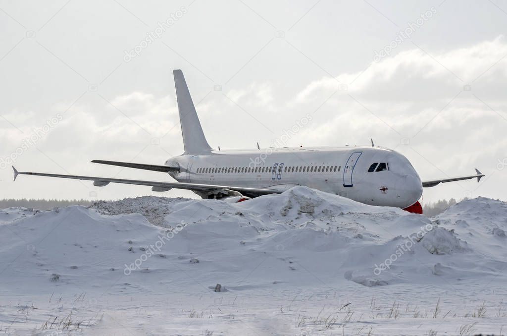 Aircraft covered by snow after a snow storm.