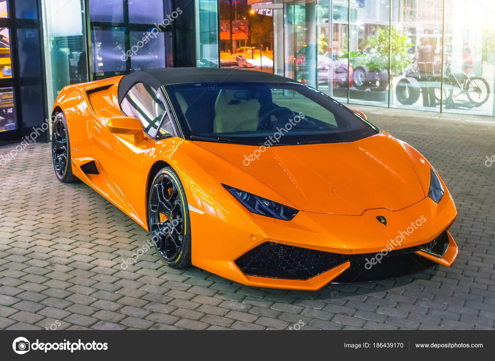 Supercar Lamborghini Aventador orange color parked at the car dealership.  Russia, Saint-Petersburg. 02 March 2018. – Stock Editorial Photo © aapsky  #186439170