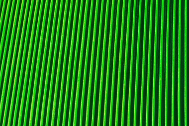 Dikey kabartma metal kaburga arka plan yeşil renk ile kaplı.