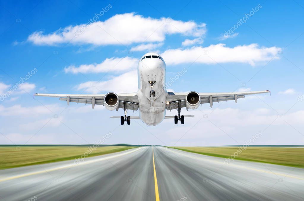 Airplane aircraft flying departure landing speed motion on a runway in the good weather with cumulus clouds sky day.