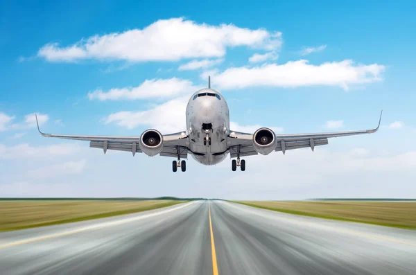 Airplane aircraft flying departure after a long flight, landing speed motion on a runway in the good weather with cumulus clouds sky day. — Stock Photo, Image
