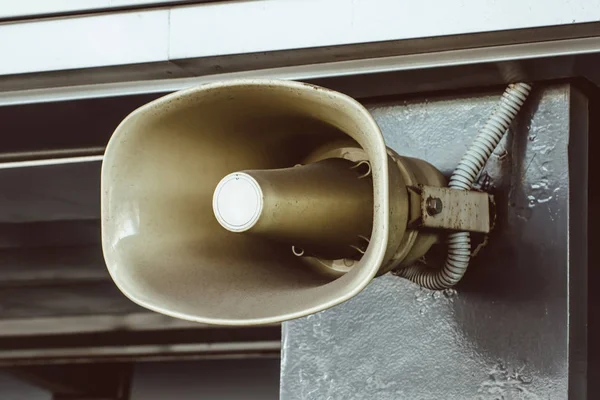 Shout, a megaphone installed on the wall of the building, for voice information messages of the people.